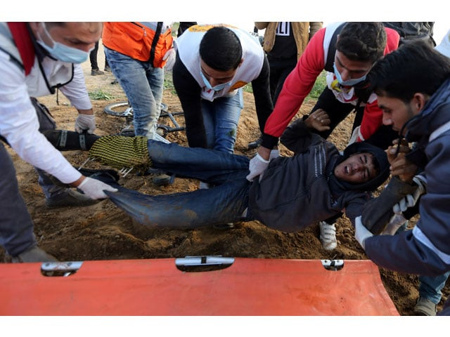 a wounded palestinian is evacuated during a protest near the israel gaza border fence in the southern gaza strip december 21 2018 photo reuters a wounded palestinian is evacuated during a protest near the israel gaza border fence in the southern gaza strip december 21 2018 photo reuters