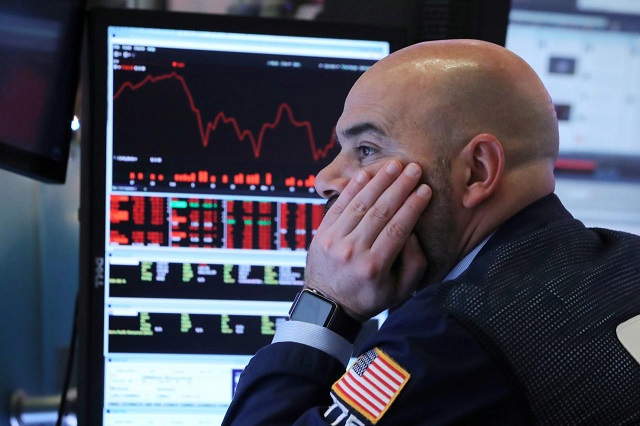 a trader works on the floor at the new york stock exchange nyse in new york city new york us december 4 2018 photo reuters