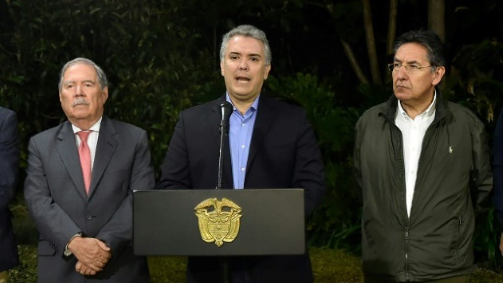 colombian president ivan duque c speaks next to colombian defense minister guillermo botero l and colombian attorney general nestor humberto martinez r at the narino presidential palace in bogota colombia photo afp