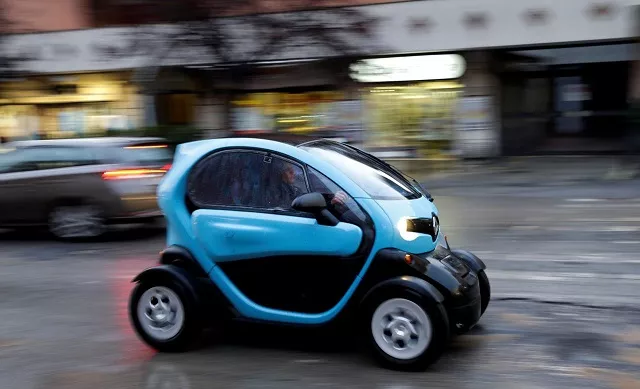 a woman drives a renault twizy two seat electric car in rome italy march 5 2018 photo reuters a woman drives a renault twizy two seat electric car in rome italy march 5 2018 photo reuters