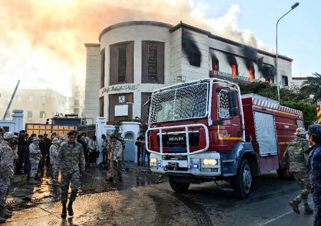 a firetruck and security officers at the scene of an attack on the libyan foreign ministry photo afp