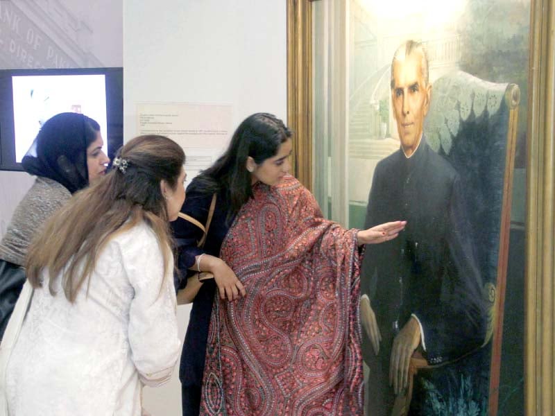 women take a closer look at a portrait of quaid e azam painted by prof saeed akhar at an exhibition at sbp museum on tuesday photo ppi