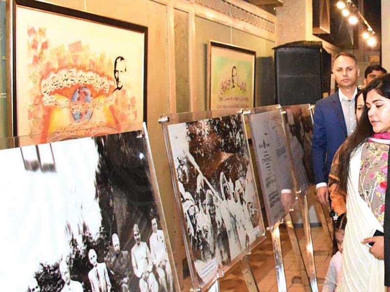 visitors look at pictures of quaid i azam photo express