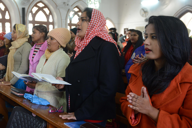 indian christian offer prayers during a service to mark christmas day at a church in amritsar photo afp indian christian offer prayers during a service to mark christmas day at a church in amritsar photo afp