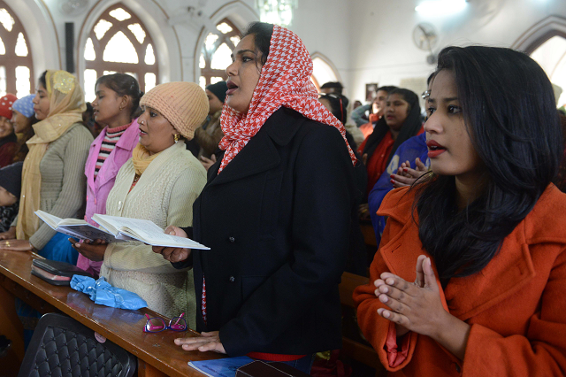 indian christian offer prayers during a service to mark christmas day at a church in amritsar photo afp