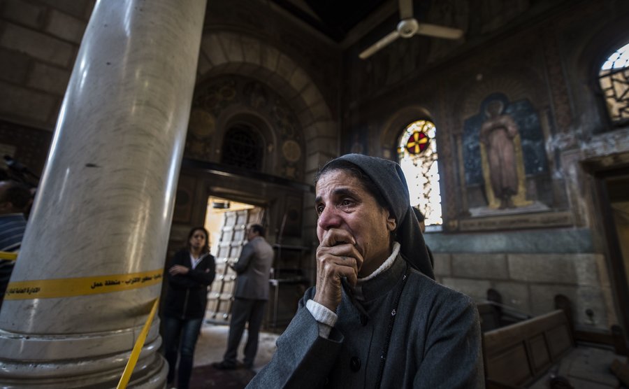 coptic christian mourns the deaths of fellow worshipers following a terrorist attack in cairo photo afp