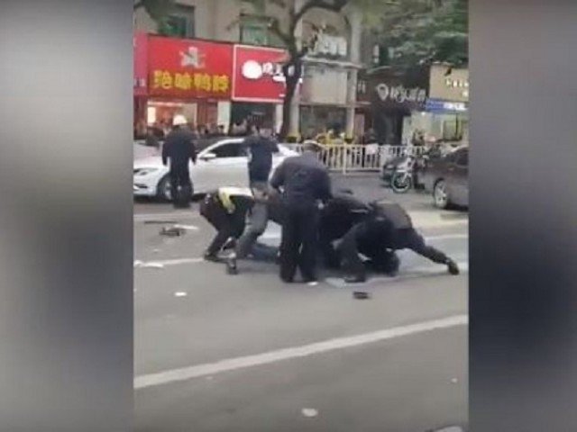 screengrab of video footage circulating online said to be showing police subduing one of the attackers in china 039 s fujian province