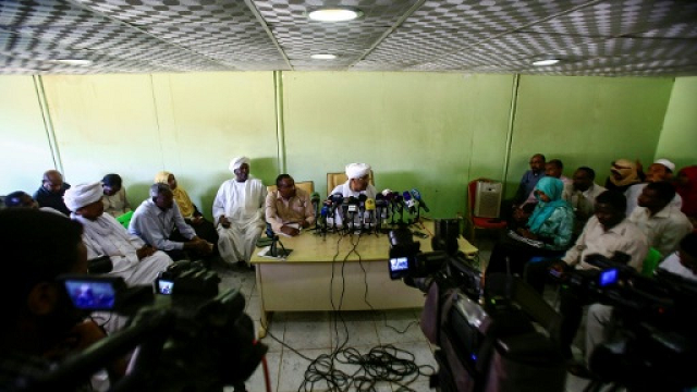 journalists gather at a press conference by idris suleman a senior official from the popular congress party in khartoum on december 26 2018 photo afp