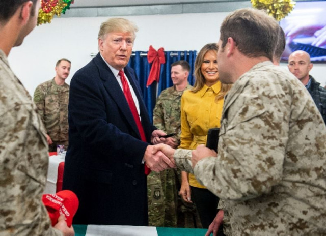 us president donald trump and first lady melania trump during an unannounced trip to al asad air base in iraq photo afp us president donald trump and first lady melania trump during an unannounced trip to al asad air base in iraq photo afp