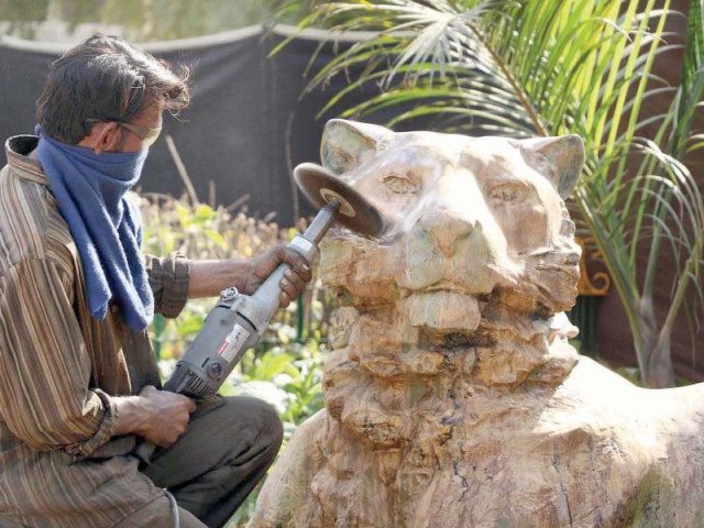 a worker reinstalls the metal statue of a lion which was given to mohatta palace museum eight years ago for an exhibition in an effort to make the zoo enjoyable for children photo online a worker reinstalls the metal statue of a lion which was given to mohatta palace museum eight years ago for an exhibition in an effort to make the zoo enjoyable for children photo online