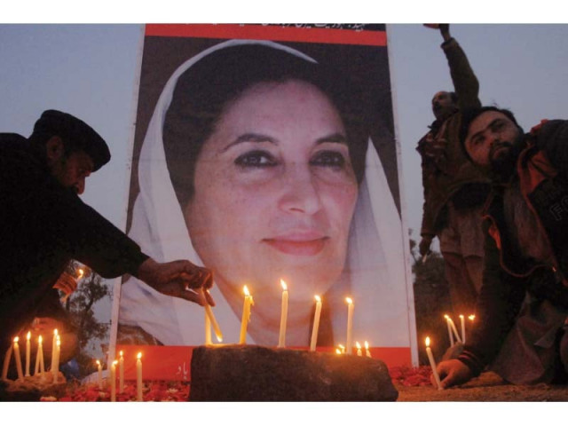 ppp workers and supporters light candles before a large poster of slain prime minister benazir bhutto in islamabad on thursday photo zafar aslam express ppp workers and supporters light candles before a large poster of slain prime minister benazir bhutto in islamabad on thursday photo zafar aslam express