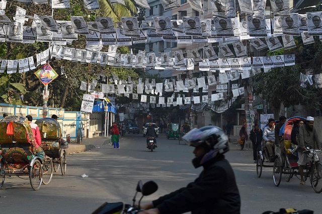 election posters hang in a dhaka street on december 28 2018 photo afp