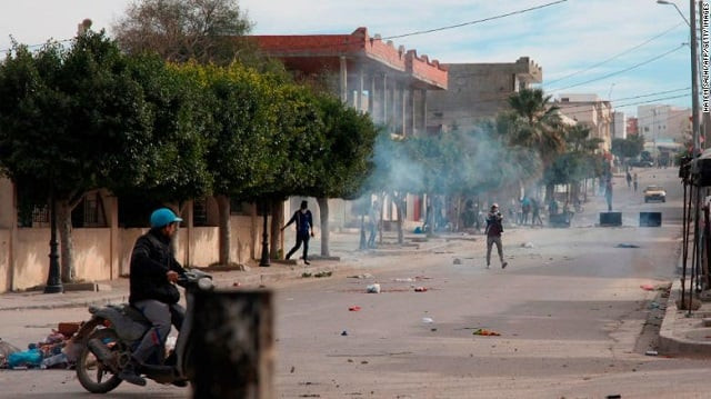 tunisian protesters throw rocks at policemen during a demonstration on december 25 2018 in the west central tunisian city of kasserine photo courtesy cnn