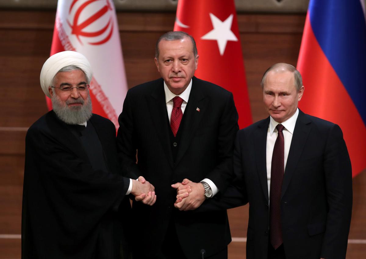 presidents hassan rouhani of iran tayyip erdogan of turkey and vladimir putin of russia hold a joint news conference after their meeting in ankara turkey in april photo reuters