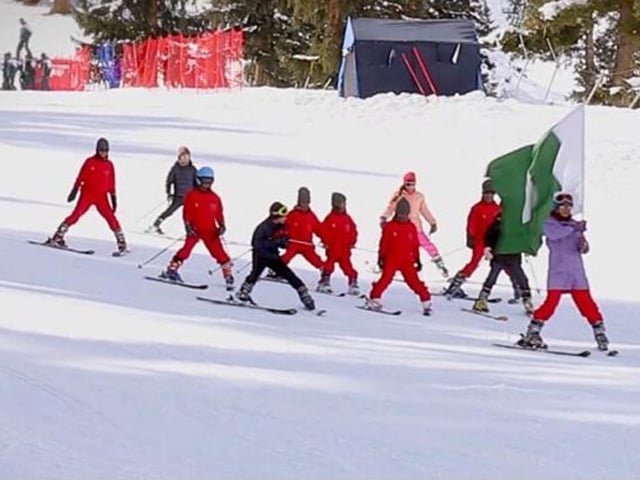 a group of young skiers displaying the pakistani flag during the opening round of sadia khan ski cup on friday photo paf