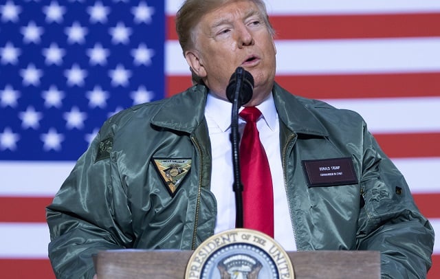 us president donald trump speaks to members of the us military during an unannounced trip to al asad air base in iraq december 26 2018 photo afp