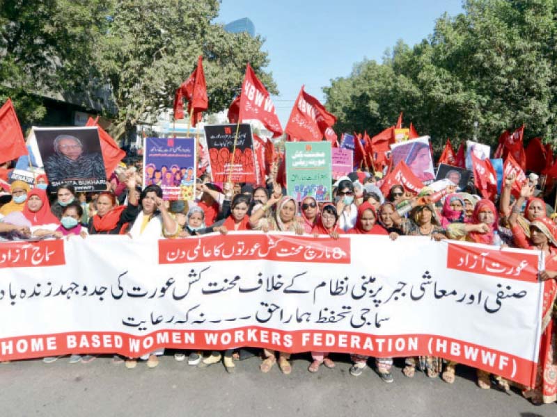 home based workers and other civil society groups including labour rights activists lead a rally on deen muhammad wafai road photo jalal qureshi express