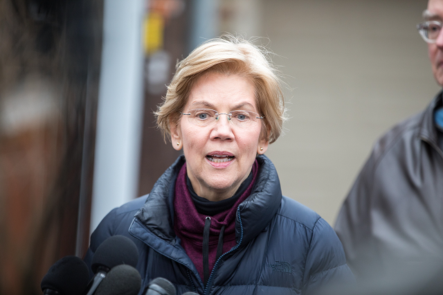 sen elizabeth warren d ma addresses the media outside of her home after announcing she formed an exploratory committee for a 2020 presidential run on december 31 2018 in cambridge massachusetts photo afp