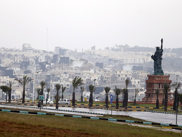 a replica of the statue of liberty stands on a hill overlooking the construction of new homes in bahria town on the outskirts of islamabad photo reuters a replica of the statue of liberty stands on a hill overlooking the construction of new homes in bahria town on the outskirts of islamabad photo reuters