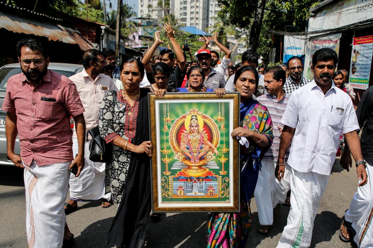 protesters hold a portrait of hindu deity ayappa as they take part in a rally called by various hindu organisations after two women entered the sabarimala temple in kochi india photo reuters