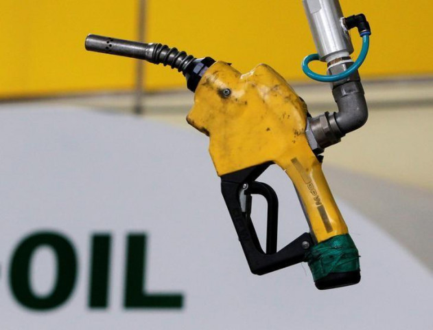 a gas pump is seen hanging from the ceiling at a petrol station photo reuters a gas pump is seen hanging from the ceiling at a petrol station photo reuters
