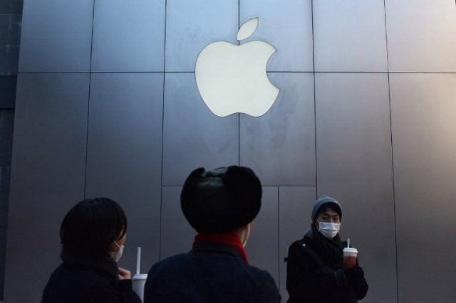 people walk past an apple store in beijing on december 11 2018 apple stores in china continued with business as usual on december 11 despite a chinese court ordered ban on iphone sales that could hurt the us tech firm in one of its most crucial markets photo afp people walk past an apple store in beijing on december 11 2018 apple stores in china continued with business as usual on december 11 despite a chinese court ordered ban on iphone sales that could hurt the us tech firm in one of its most crucial markets photo afp