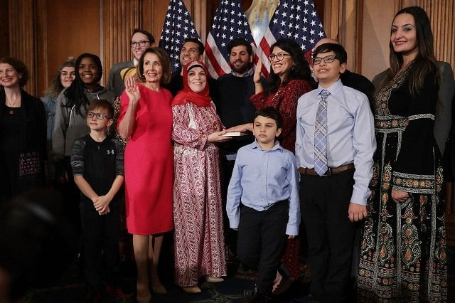 speaker of the house nancy pelosi d ca poses for photographs with rep rashida tlaib d mi and her family in the rayburn room at the u s capitol january 03 2019 in washington dc photo afp speaker of the house nancy pelosi d ca poses for photographs with rep rashida tlaib d mi and her family in the rayburn room at the u s capitol january 03 2019 in washington dc photo afp