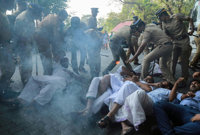 protests broke out after police escorted two women into a flashpoint temple in the southern indian state of kerala on wednesday photo afp protests broke out after police escorted two women into a flashpoint temple in the southern indian state of kerala on wednesday photo afp