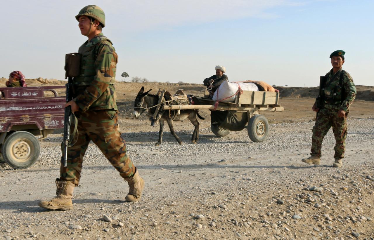 afghan national army ana troops keep watch at a check point in aqcha district of jawzjan province afghanistan photo reuters