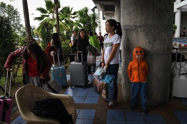 chinese tourists wait for information at surat thani airport after tour operators were forced to suspend boats to tourist islands due to tropical storm pabuk photo afp chinese tourists wait for information at surat thani airport after tour operators were forced to suspend boats to tourist islands due to tropical storm pabuk photo afp