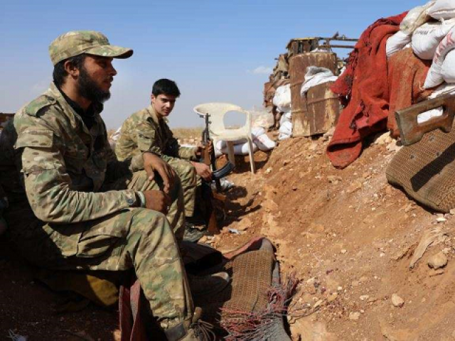 syrian opposition fighters from the national liberation front in idlib province photo afp