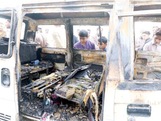 children look into the burnt out hi roof van which caught fire because of short circuit photo online children look into the burnt out hi roof van which caught fire because of short circuit photo online