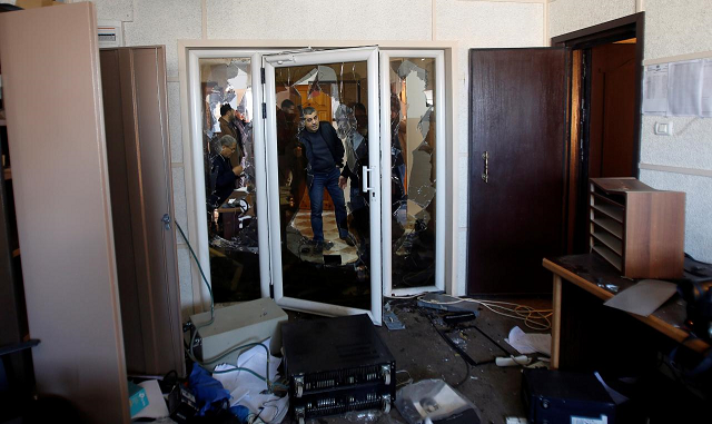 palestinians inspect the damage inside the office of palestine tv in gaza city january 4 2019 photo reuters
