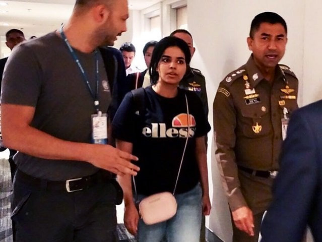 this handout picture taken and released by thai immigration bureau on january 7 2019 shows 18 year old saudi woman rahaf mohammed al qanun 2nd l is being escorted by the thai immigration officer and united nations high commissioner for refugees unhcr officials at the suvarnabhumi international airport in bangkok photo afp this handout picture taken and released by thai immigration bureau on january 7 2019 shows 18 year old saudi woman rahaf mohammed al qanun 2nd l is being escorted by the thai immigration officer and united nations high commissioner for refugees unhcr officials at the suvarnabhumi international airport in bangkok photo afp