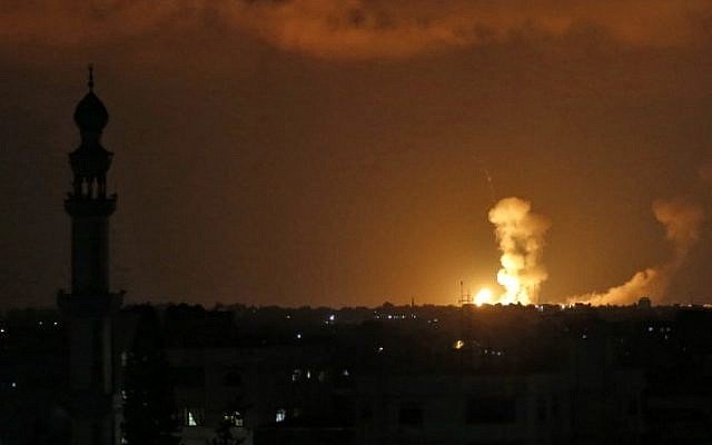 explosions are seen following israeli strikes in khan younis in the southern gaza strip on july 20 2018 photo afp