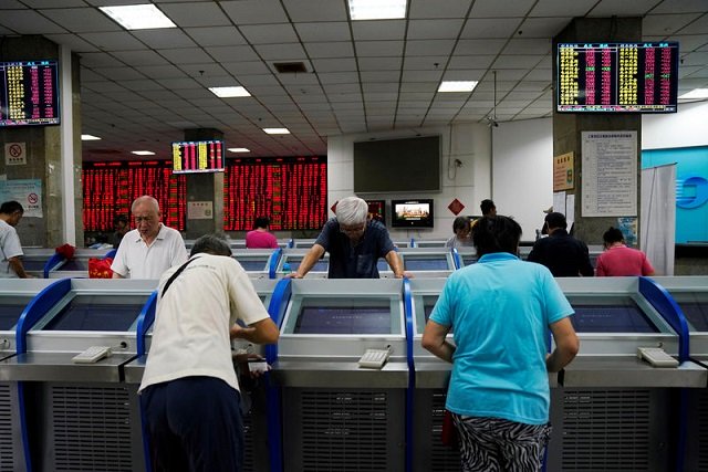 investors look at computer screens showing stock information at a brokerage house in shanghai china september 7 2018 photo reuters