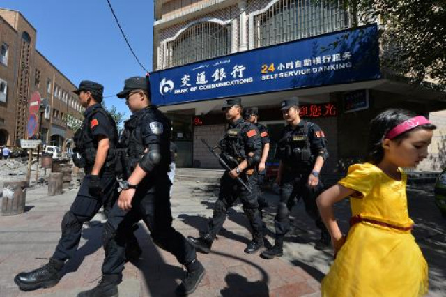 chinese armed police patrol the streets of the muslim uighur quarter in urumqi after a series of terrorist attacks hit xinjiang province chinese armed police patrol the streets of the muslim uighur quarter in urumqi after a series of terrorist attacks hit xinjiang province