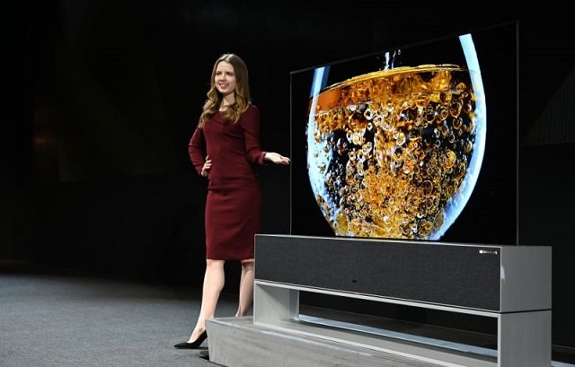 the signature oled tv r a roll up television is presented ahead of the official start of the consumer photo afp