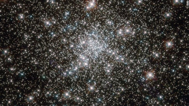 a globuler cluster of stars captured by the hubble telescope photo cnn a globuler cluster of stars captured by the hubble telescope photo cnn