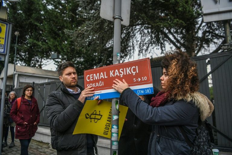 members of amnesty international hang a sign reading quot jamal khashoggi street quot where the saudi arabian consulate is located in istanbul during a ceremony marking 100 days since the murder of the journalist there photo afp
