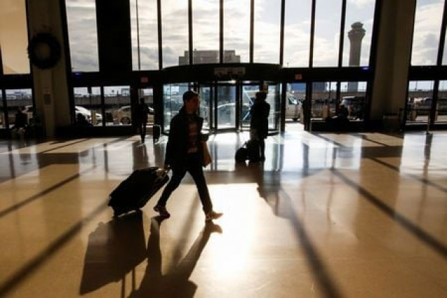 travelers make their way through newark liberty international airport in newark new jersey us photo reuters travelers make their way through newark liberty international airport in newark new jersey us photo reuters