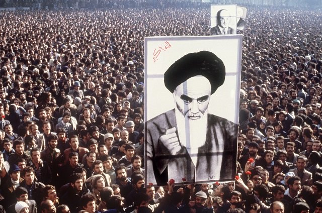 iranian demonstrators hold a poster of ayatollah ruhollah khomeini in january 1979 during a demonstration in teheran against the shah photo reuters