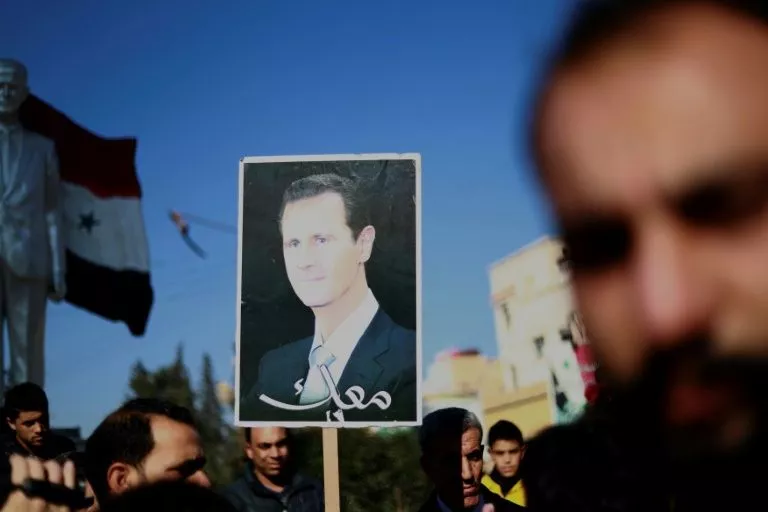 syrian demonstrators hold a portrait of president bashar al assad during a demonstration in the northeastern city of qamishli photo afp syrian demonstrators hold a portrait of president bashar al assad during a demonstration in the northeastern city of qamishli photo afp