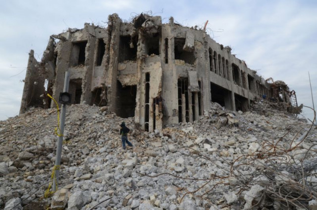 an iraqi climbs up the rubble of the seven storey building in mosul used by the islamic state group to throw men accused of being gay to their deaths photo afp an iraqi climbs up the rubble of the seven storey building in mosul used by the islamic state group to throw men accused of being gay to their deaths photo afp