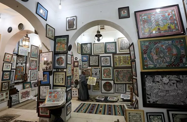 artist hassan el shark holds his piece of art at his gallery in minya governorate upper egypt photo reuters artist hassan el shark holds his piece of art at his gallery in minya governorate upper egypt photo reuters