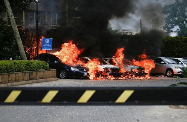 burning cars are seen at the scene where explosions and gunshots were heard at the dusit hotel compound in nairobi kenya photo reuters burning cars are seen at the scene where explosions and gunshots were heard at the dusit hotel compound in nairobi kenya photo reuters