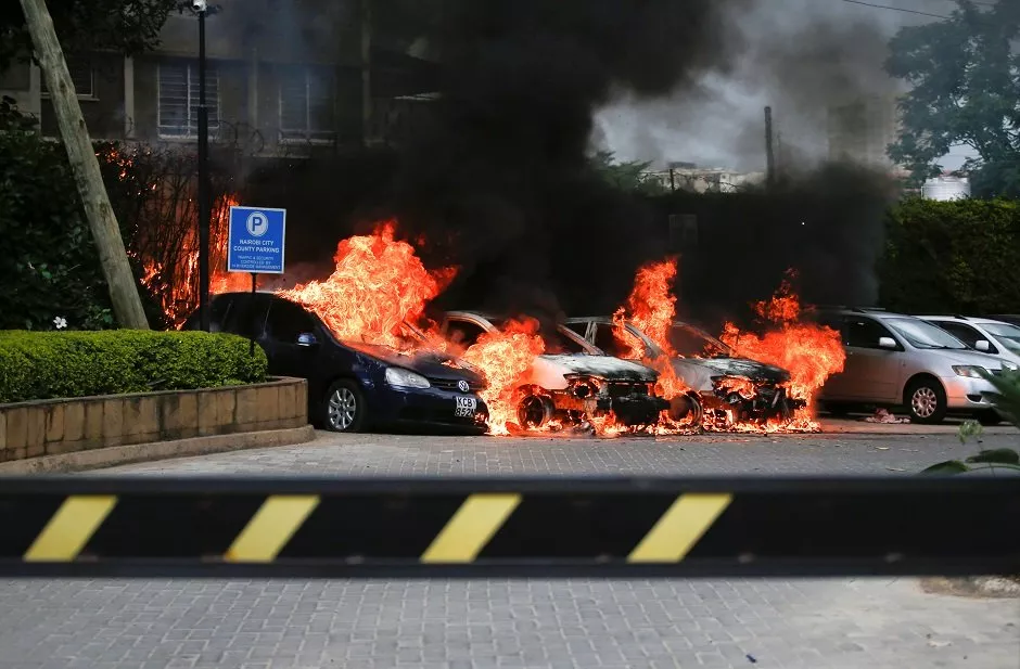 burning cars are seen at the scene where explosions and gunshots were heard at the dusit hotel compound in nairobi kenya photo reuters burning cars are seen at the scene where explosions and gunshots were heard at the dusit hotel compound in nairobi kenya photo reuters