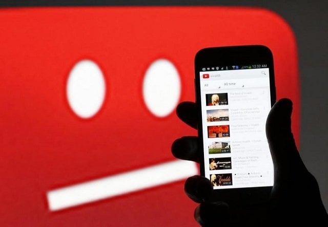 a picture illustration shows youtube on a cell phone in front of a youtube copyright message regarding a video on an lcd screen in central bosnian town of zenica photo reuters