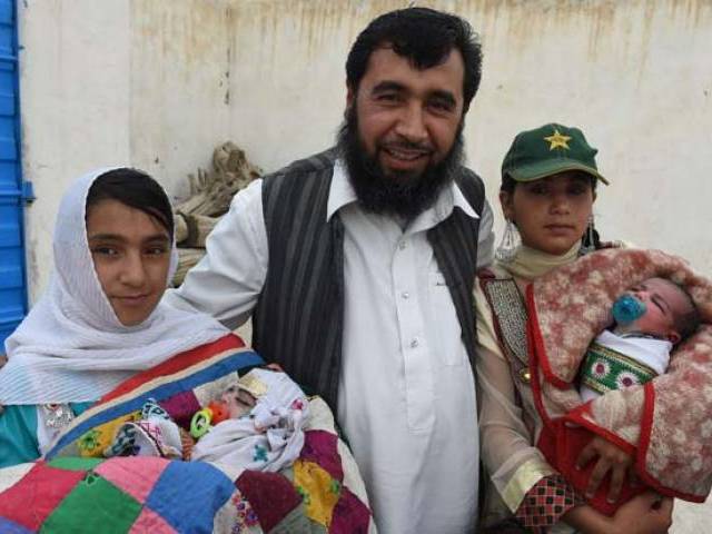 in this photograph taken on march 23 2016 pakistani father sardar haji jan mohammad khilji poses with some of his children at his residence in quetta photo afp file