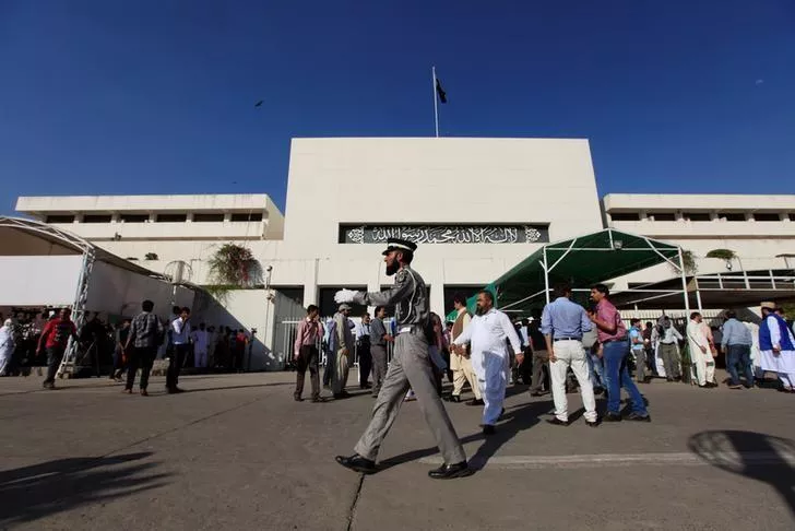 a traffic policeman walks in front of the parliament building photo reuters a traffic policeman walks in front of the parliament building photo reuters